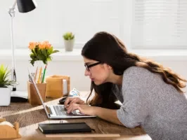woman with bad posture over computer